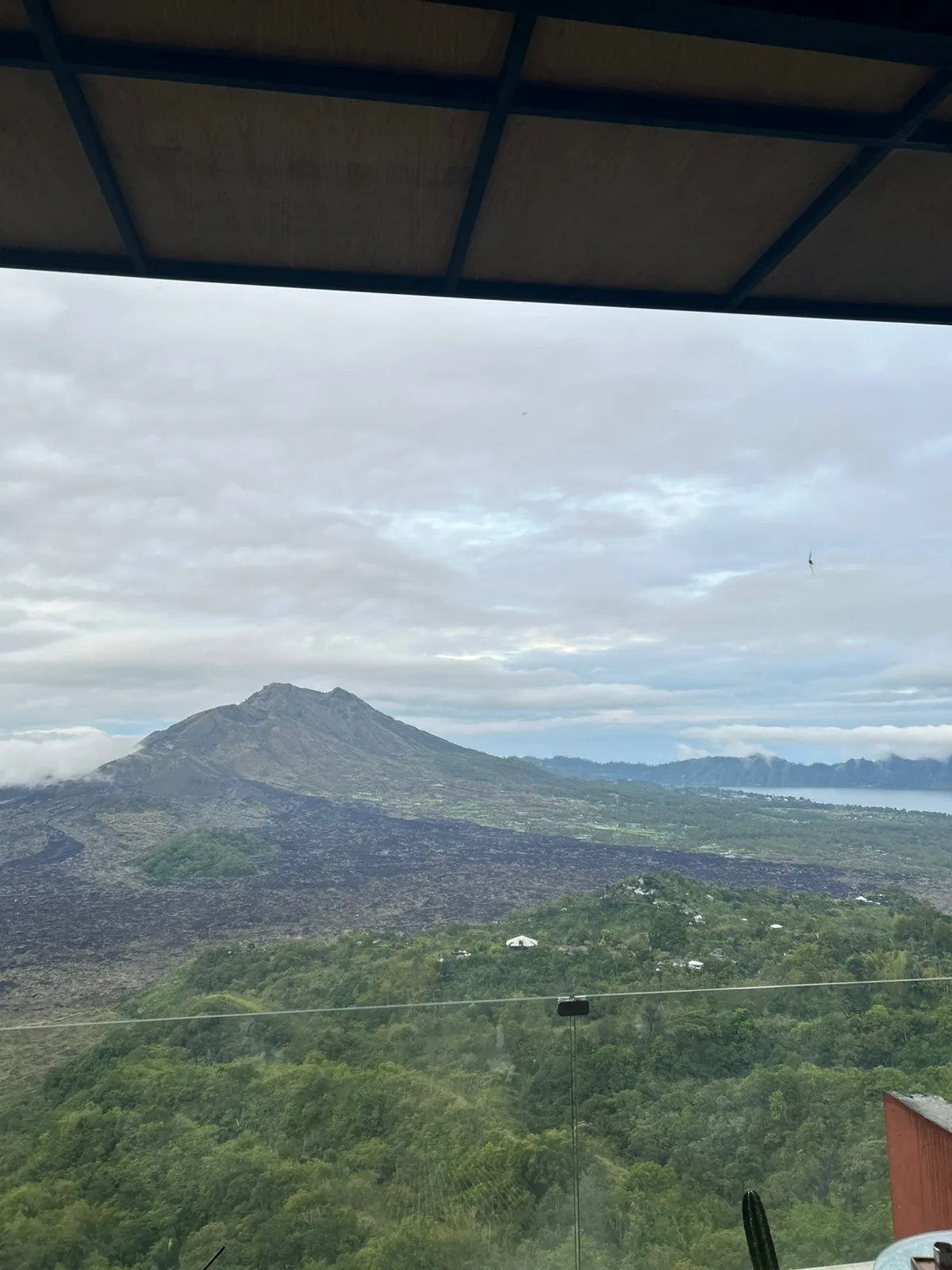 Mount Batur rising above the clouds at sunrise