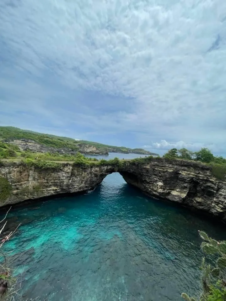 Limestone cliffs above a turquoise bay on Nusa Penida
