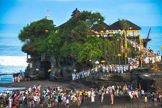 Tanah Lot temple standing on its rock above the surf